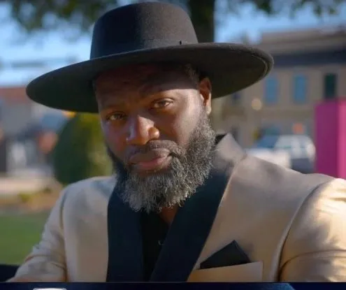 Damiun Raines outdoors in a hat
